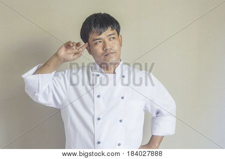 Chef portrait Asian young chef crossing arms.
