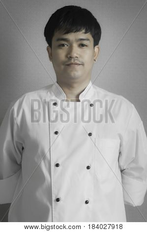 Chef portrait Asian young chef crossing arms.