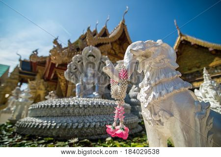 elephant statue and temple blur background buddhist Thailand