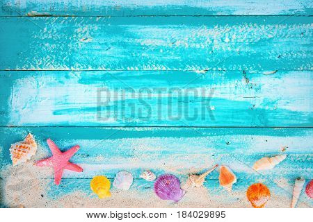 Summer background - starfish shells coral on wood table background. vintage color tone styles.