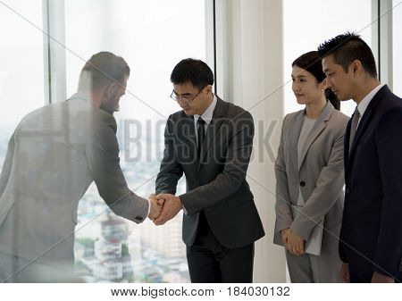 Business Partners Introductionary Handshake Bow