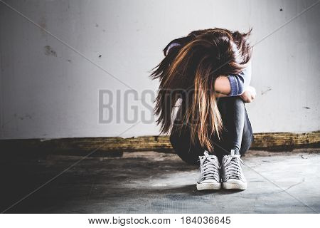 Sad Woman Sitting Alone In A Empty Room. Sressful Concept.