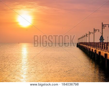 Sunrise over the sea with bridge and lighthouse at prachuapkhirikhanThailand