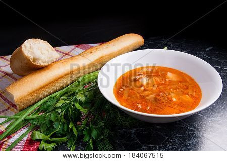 Vegetables And Meat In Red Beetroot Soup Or Borsch In White Plate On Dark Marble Background.