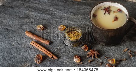 Traditional Indian Masala Tea In Ceramic Cup With Spices To Milk