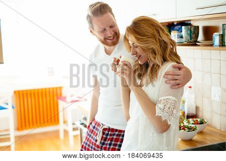 Romantic couple in love speding time together in kitchen