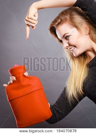 Woman Holding Warm Red Hot Water Bottle