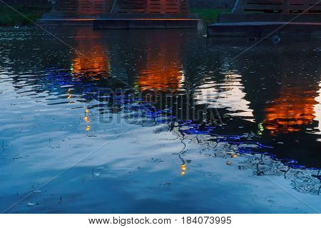 bridge night city reflected in water with lights and reflections. Uzghorod Uzhhorod