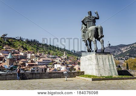 Monument to Tsar Vakhtang Gorgasal near the ancient fortress of the 13th century in Tbilisi Georgia. April 17 2015. View on the river