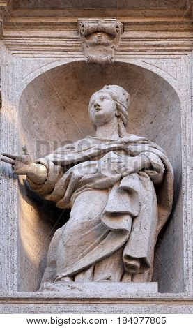 ROME, ITALY - SEPTEMBER 02: Saint Jeanne de Valois statue on the facade of Chiesa di San Luigi dei Francesi - Church of St Louis of the French, Rome, Italy on September 02, 2016.