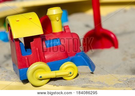 Children's train in the sandbox photo macro
