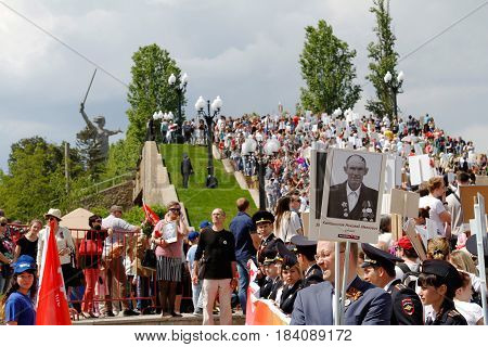Volgograd Russia - May 9 2016: Procession of local people with photos of their relatives in Immortal Regiment on annual Victory Day on Mamaev Hill in Volgograd