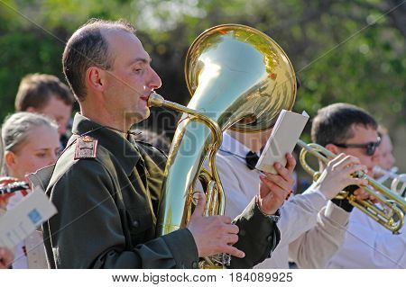 Volgograd Russia - May 08 2014: Musician in military uniform with trumpet takes part in Victory day event in Volgograd