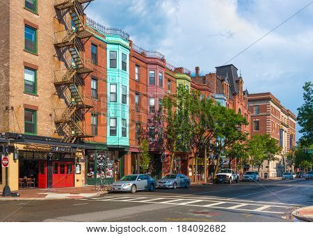 Boston - June 2016, USA: View of the typical street of Boston in Back Bay after the rain, old brick houses in traditional architecture style and cars parked near them