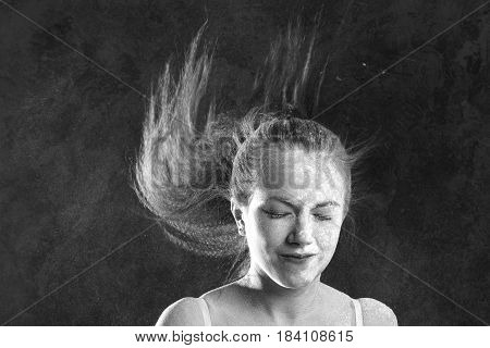 Black and white portrait of young dancer with white flour