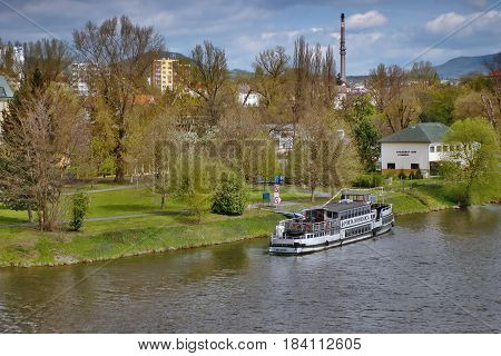 Litomerice Czech republic - April 14 2017: white Porta Bohemica ship moored on river Elbe in spring Litomerice city in Czech republic