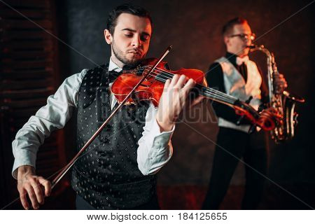 Jazz man and violinst, classical musical duet