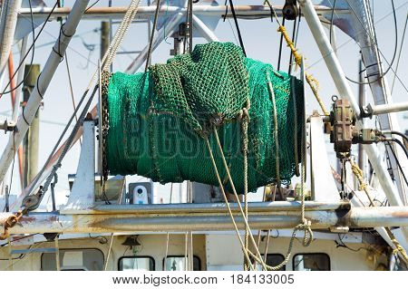 Fishing nets in a spool atop a commercial fishing boat in New Jersey.