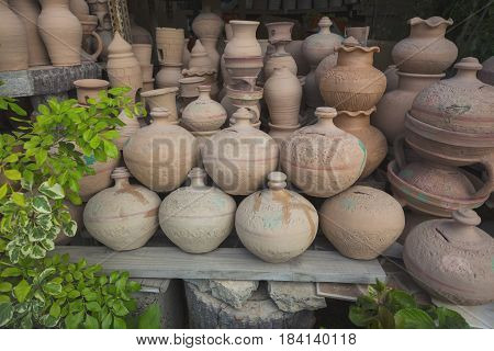 Eastern Pitchers Stand On A Shelf