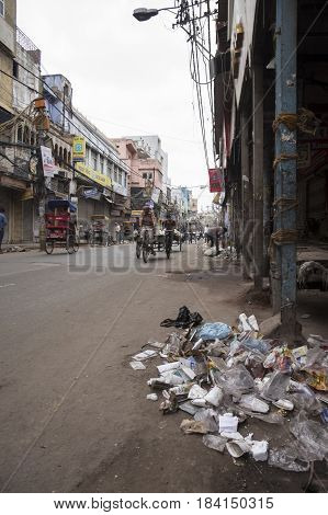 DELHI INDIA - MAR 15 : morning scene of rubbish and dirtiness on road in chawri bazar in old delhi of delhi on march 15 2015 india