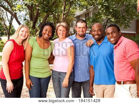 Happy commuinity group of people talking and laughing.