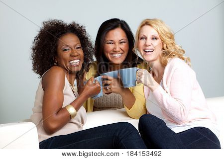 Diverse group of friends talking and laughing.