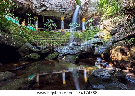 Amazing Thailand the temple under waterfall Wat Tham Heo Sin Chai waterfall. Kaeng Tana National Park Ubonratchathani Thailand