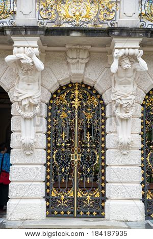 Ettal, Germany - June 5, 2016: Door trellised pig-iron, beautiful Linderhof Palace - castle of King Ludwig, southwest Bavaria, Germany