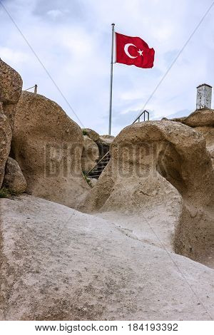 Turkish flag in the fortress Uchisar, Cappadocia, Turkey