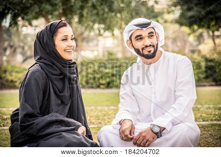 Arabic couple with traditional clothes dating outdoors
