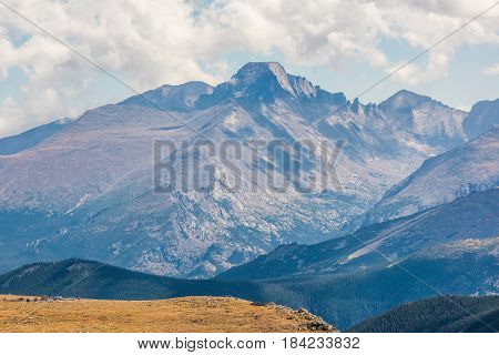 Rocky Mountains in Colorado with people at parking lot overlook
