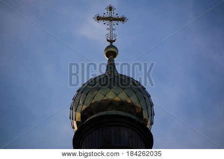 Yoshkar-Ola, Russia - May 1, 2017 Photo of an Orthodox Christian cross on a background of gloomy clouds