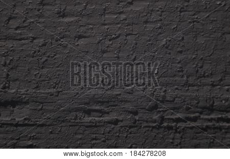 Stucco dark gray wall background texture material.