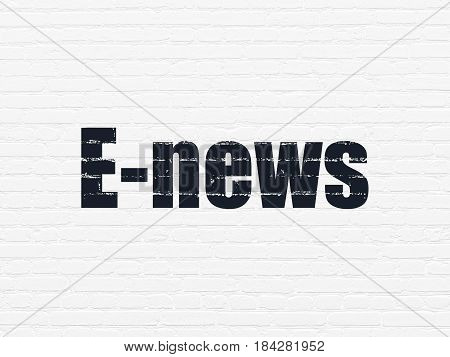 News concept: Painted black text E-news on White Brick wall background