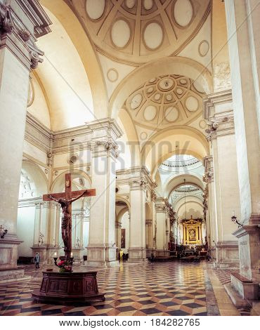 Padova Italy April 23 2017 - A wooden Jesus Christ on the cross inside the semi empty San Giustina basilica one of the biggest churches in Padova