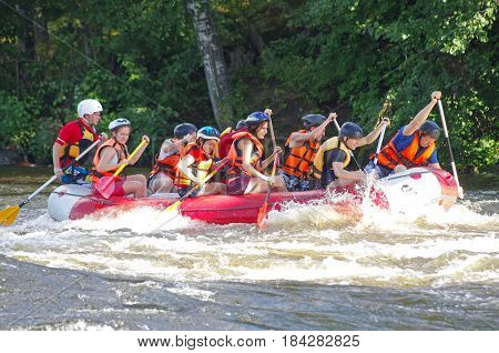 LOSEVO - AUGUST 18: Whitewater rafting on AUGUST 18 2012 RUSSIA. Unidentified persons enjoy whitewater rafting on the Vuoksi river in Losevo Leningrad region Russia