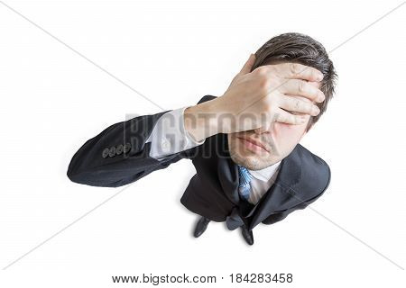 Young Unhappy And Stressed Man Made Mistake And Is Covering His