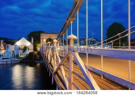 Twilight capture of the Marlow suspension bridge over the River Thames at Marlow in Buckinghamshire