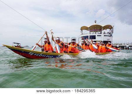 Labuan,Malaysia-April 29,2017:Group of boatman with life jacket participate in a boat tug of war games in Labuan International Sea Sports Complex at Labuan,Malaysia on 29th April 2017.