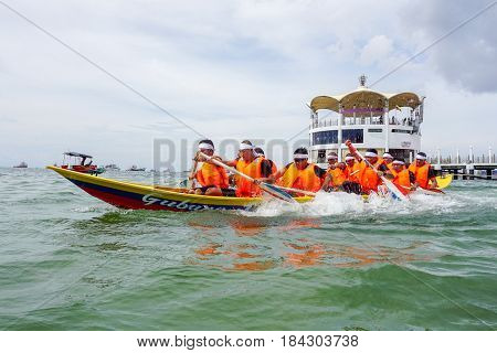 Labuan,Malaysia-April 29,2017:Group of boatman with life jacket participate in a boat tug of war games in Labuan International Sea Sports Complex at Labuan,Malaysia on 29th April 2017.