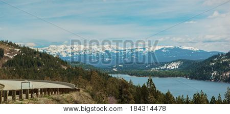 On the road to lake in Rv with snow on the mountains