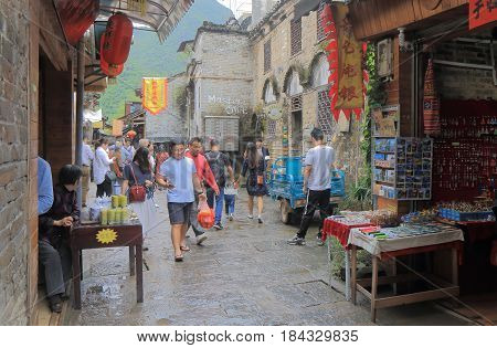 YANGSHOU CHINA - NOVEMBER 19, 2016: Unidentified people visit Xingping historical village. Xingping is a historical fishing village near Li river.