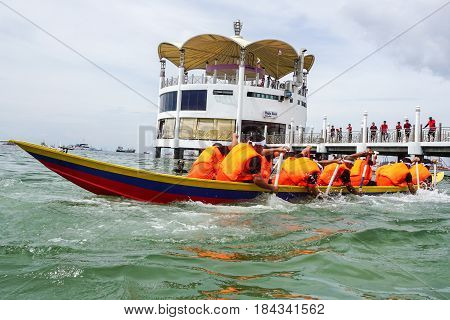 Labuan,Malaysia-April 29,2017:Group of boatman with life jacket participate in a boat tug of war games in Labuan International Sea Sports Complex at Labuan,Malaysia on 29th April 2017.