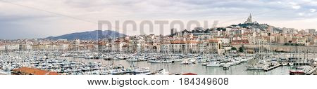 Marseille, France sunset. The famous european harbour view on the Notre Dame de la Garde panorama
