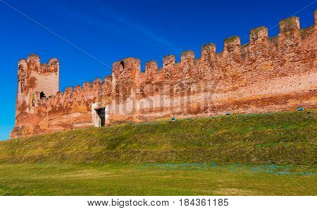 Walled city of Castelfranco Vento, small medieval city in Northern Italy, red brick wall with watchtower