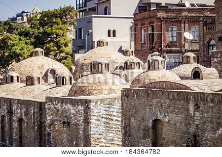 The exterier of public baths in Tbilisi. Sightseeing capital of Georgia. A view of the ancient walls and domes. April 17 2015