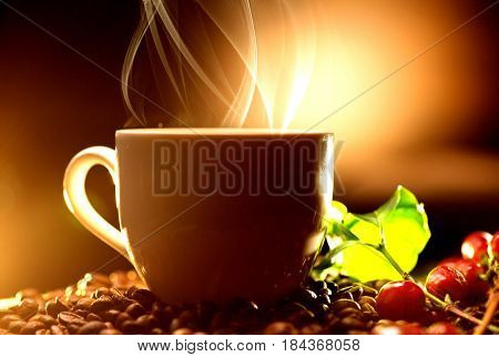 Coffee. Cup of steaming coffee with the real coffee ripe berries, flowers and leaves on a branch of coffee tree over wooden background, silhouette