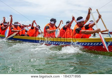 Labuan,Malaysia-April 29,2017:Group of boatman with life jacket participate in a boat tug of war games in Labuan International Sea Sports Complex at Labuan,Malaysia on 29th April 2017.