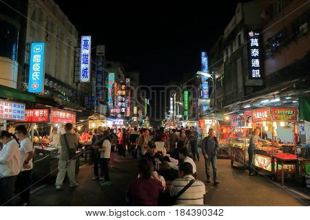 KAOHSIUNG TAIWAN - DECEMBER 13, 2016: Unidentified people visit Liuhe night street market. Liuhe market is one of the most popular markets in Taiwan.