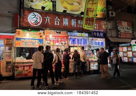 KAOHSIUNG TAIWAN - DECEMBER 13, 2016: Unidentified people visit Liuhe night street market. Liuhe market is one of the most popular markets in Taiwan.